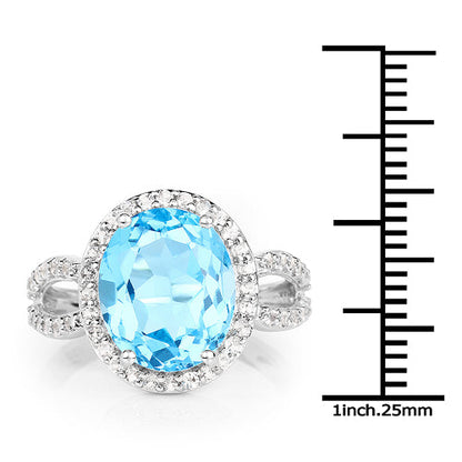 Ring with oval Swiss blue topaz haloed by white topaz in sterling silver band Bids.com on Tampa Home & Garden Store