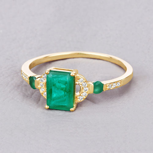 Ring: 14K yellow gold with a rectangular Zambian emerald center and diamond accents on the shoulders on Tampa Home & Garden Store