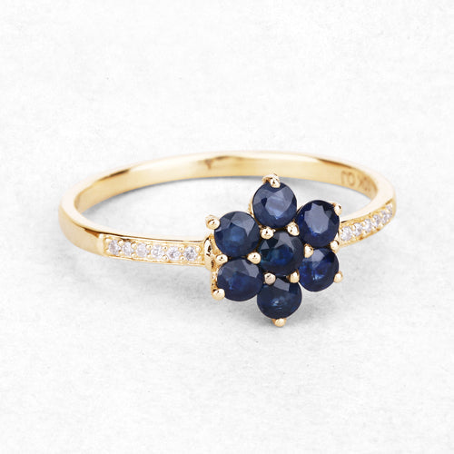 Ring, 10K yellow gold with a blue sapphire flower cluster and white diamonds along the band on Tampa Home & Garden Store