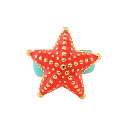 Eau Starfish Cocktail Ring with coral pink starfish and gold studs on a turquoise band on Tampa Home & Garden Store