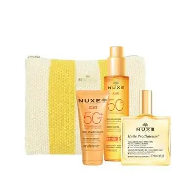 Nuxe Sun Care Set with SPF 50 sunscreen and bronzing oil in a yellow striped pouch on Tampa Home & Garden Store