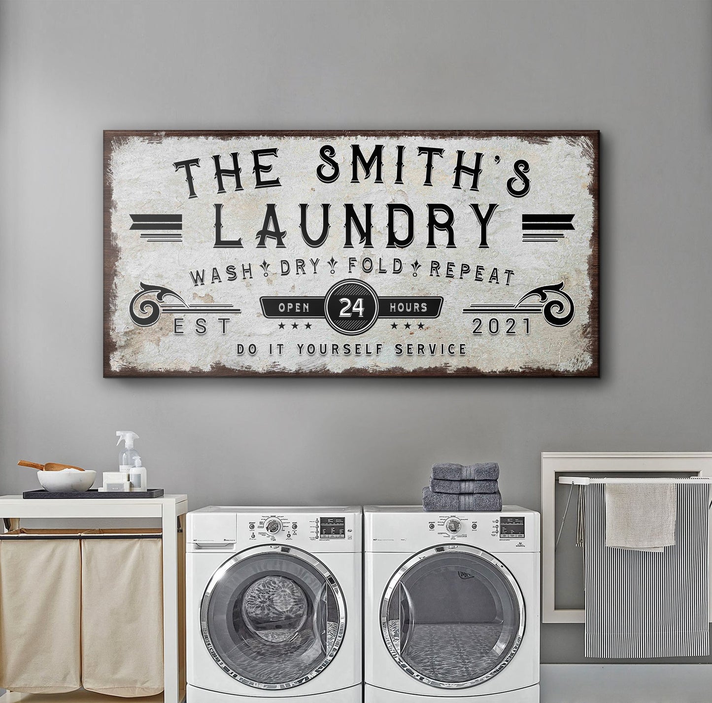 Personalized laundry room sign canvas with distressed white background and dark wood frame on Tampa Home & Garden Store