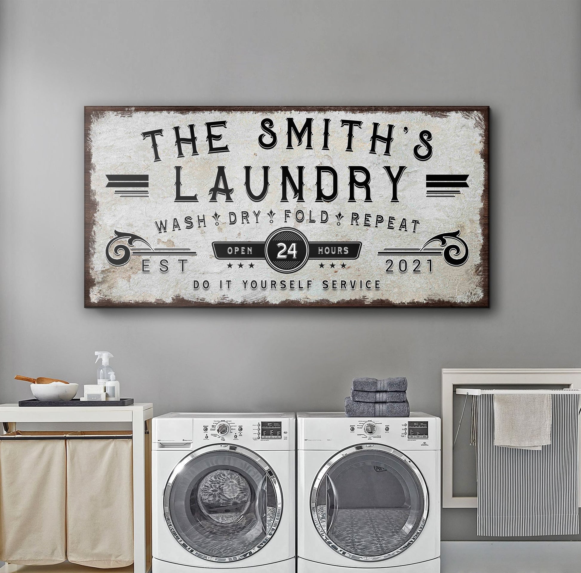 Personalized laundry room sign canvas with distressed white background and dark wood frame on Tampa Home & Garden Store