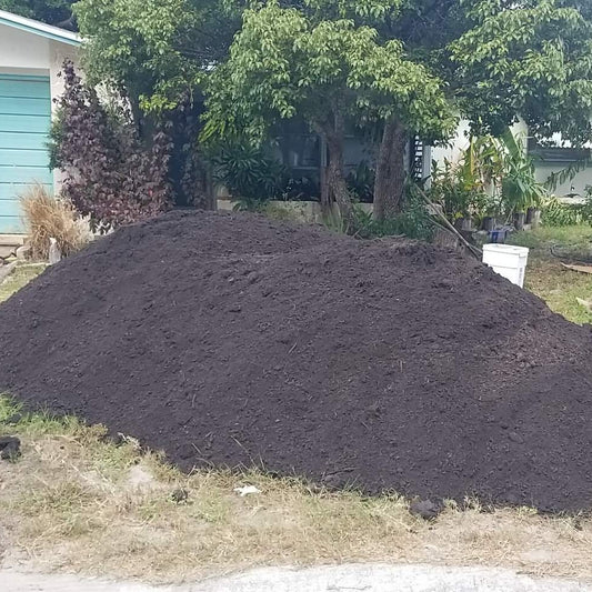 A 9 cubic yard pile of Compost mix delivered and dumped on the front yard.