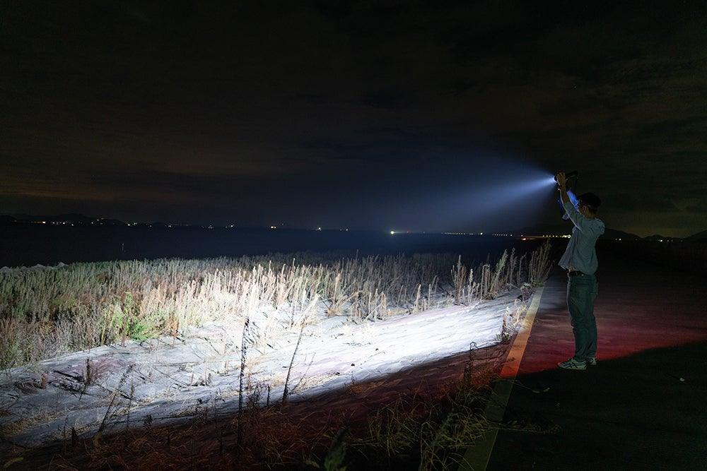 Rechargeable Stevvex LED flashlight with adjustable beam in use at night on a coastal road on Tampa Home & Garden Store