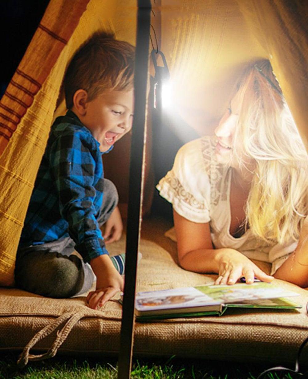 Rechargeable USB LED flashlight with COB work light inside a tent, mother and child reading a book on Tampa Home & Garden Store