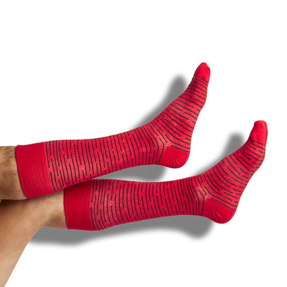 DeadSoxy red and black dress socks 4-pack, striped pattern, two socks visible on leg on Tampa Home & Garden Store
