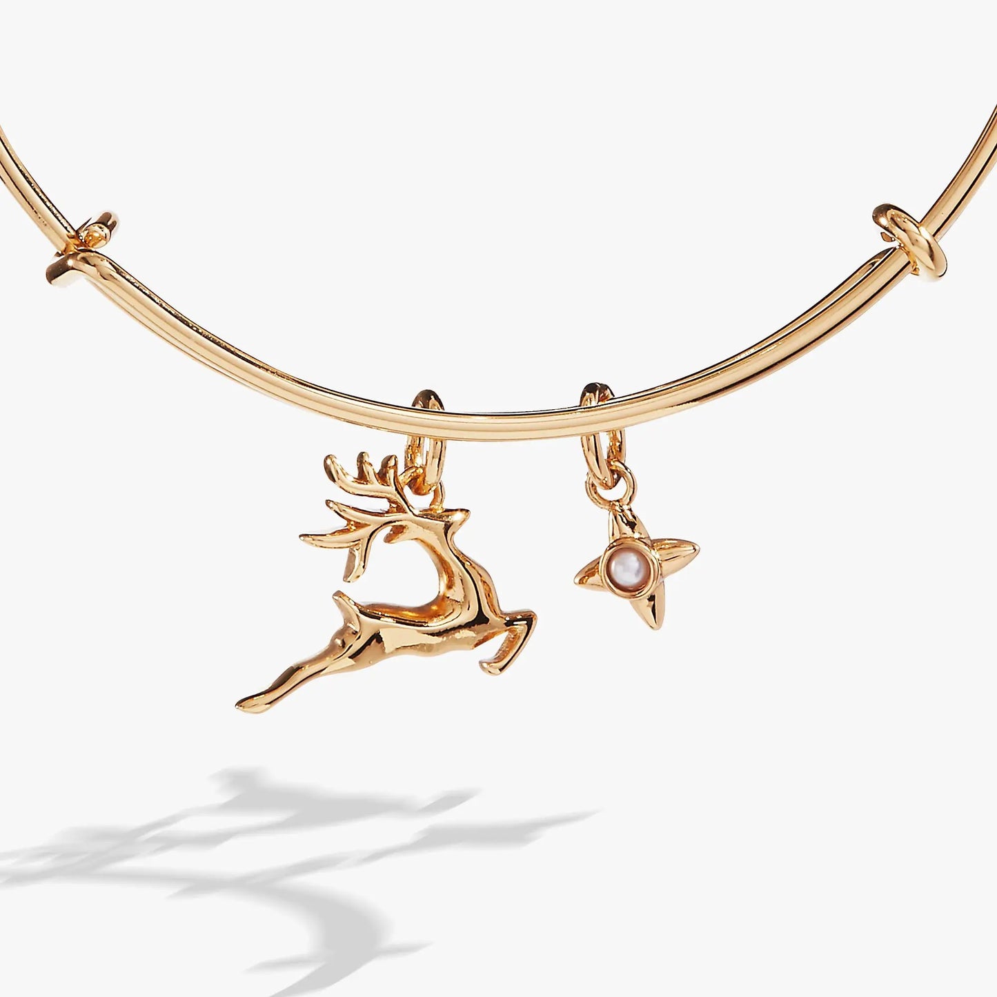 Holiday Reindeer Bangle bracelet in gold-tone with two charms: reindeer and pearl charm on Tampa Home & Garden Store