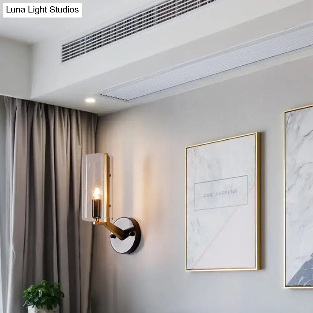 Brass Glass Wall Sconce industrial style with vertical glass shade and black mount on Tampa Home & Garden Store