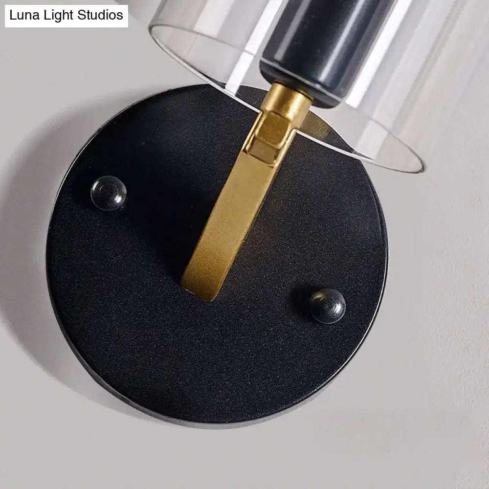 Brass glass wall sconce with black circular base and gold arm, industrial style Decorbites on Tampa Home & Garden Store