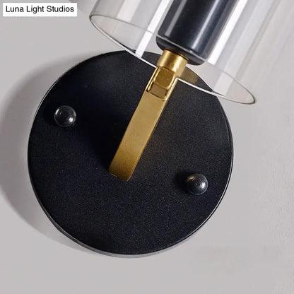Brass glass wall sconce with black circular base and gold arm, industrial style Decorbites on Tampa Home & Garden Store
