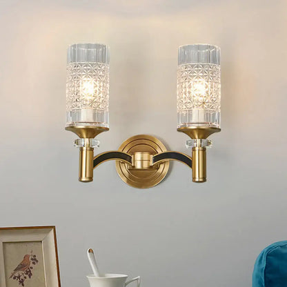 Brass crystal gridded wall sconce with dual textured glass shades and round backplate on Tampa Home & Garden Store