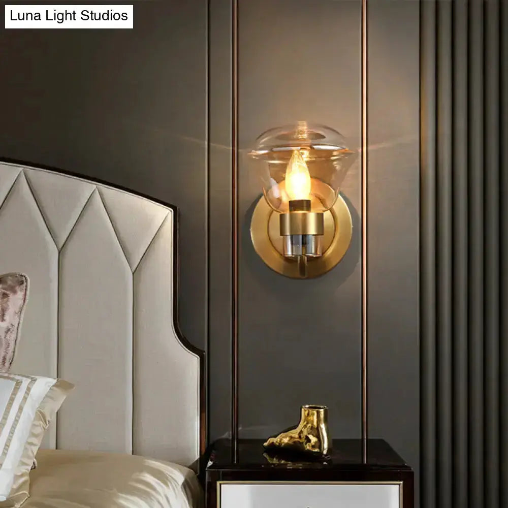 Retro brass bedroom wall sconce with smoke gray and amber glass globe by Decorbites on Tampa Home & Garden Store