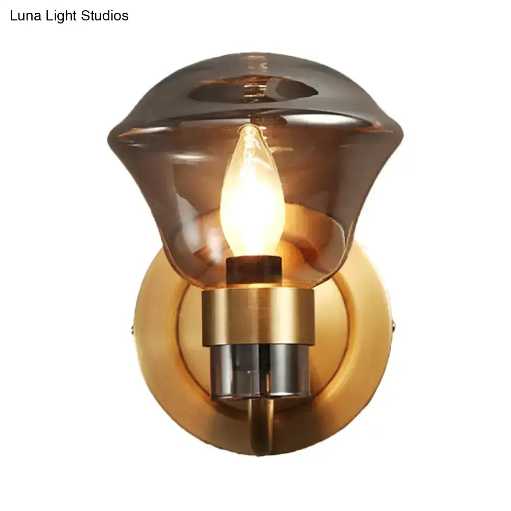 Retro brass wall sconce with smoke gray amber glass shade and candle bulb by Decorbites on Tampa Home & Garden Store