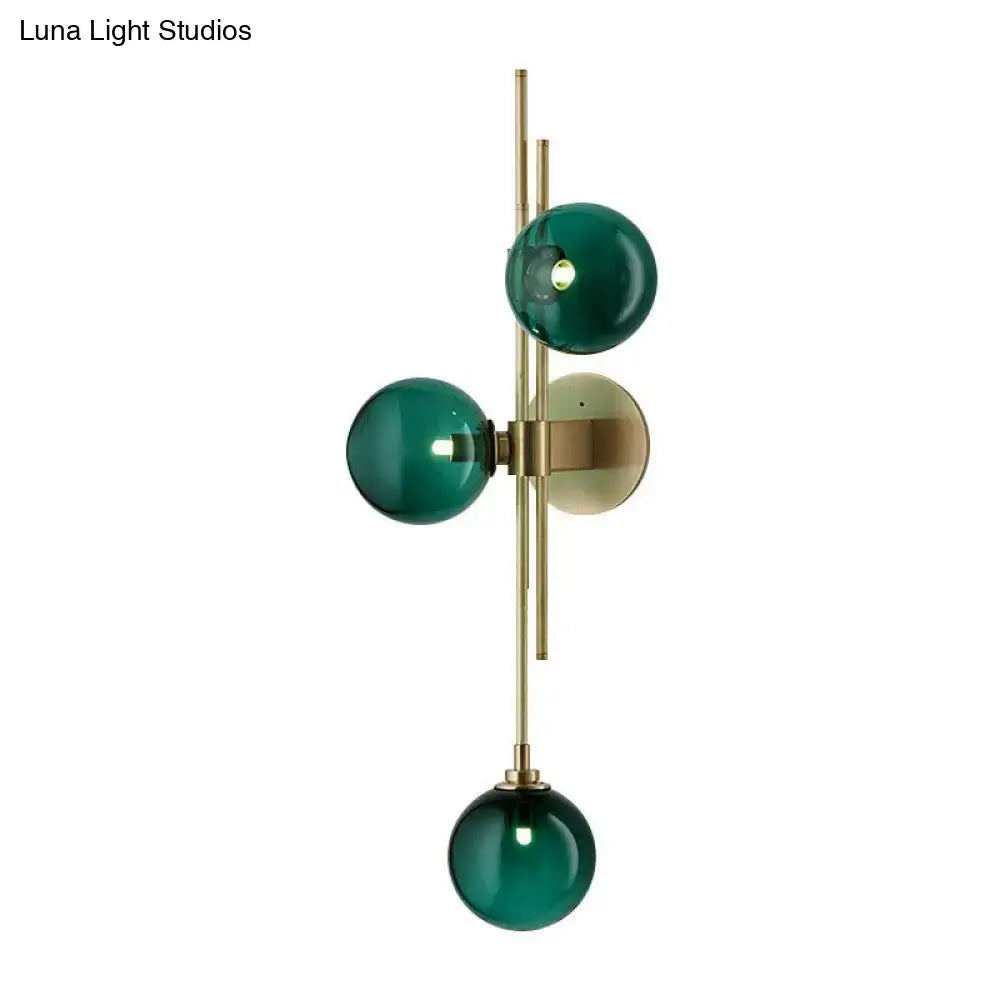 Brass triple globe sconce with three green glass orbs and wall mount Decorbites on Tampa Home & Garden Store