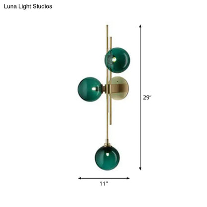 Brass triple globe sconce with green glass globes, wall mount Decorbites on Tampa Home & Garden Store
