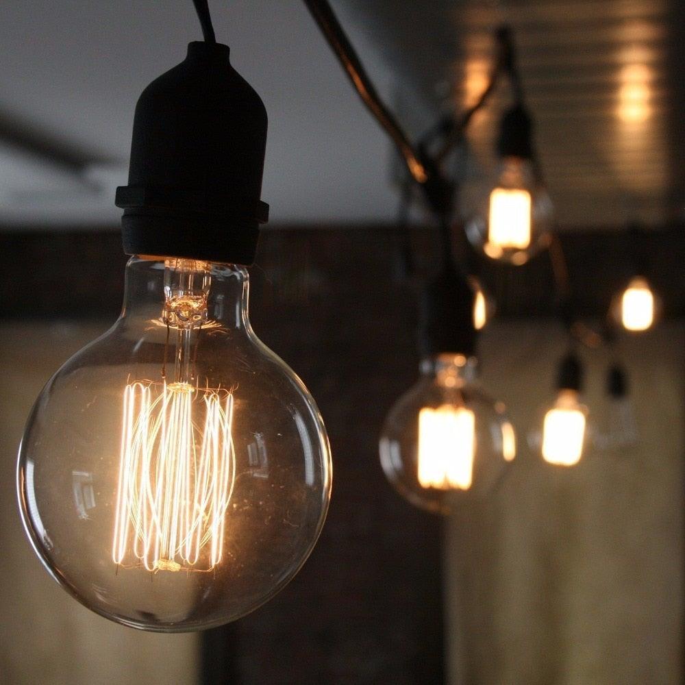Retro Edison bulb filament bulb by Stevvex in clear glass with warm glow in hanging pendant on Tampa Home & Garden Store