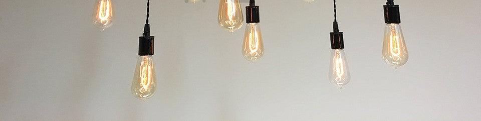 Retro Edison filament bulbs, six clear glass hanging pendant bulbs with visible filaments on Tampa Home & Garden Store