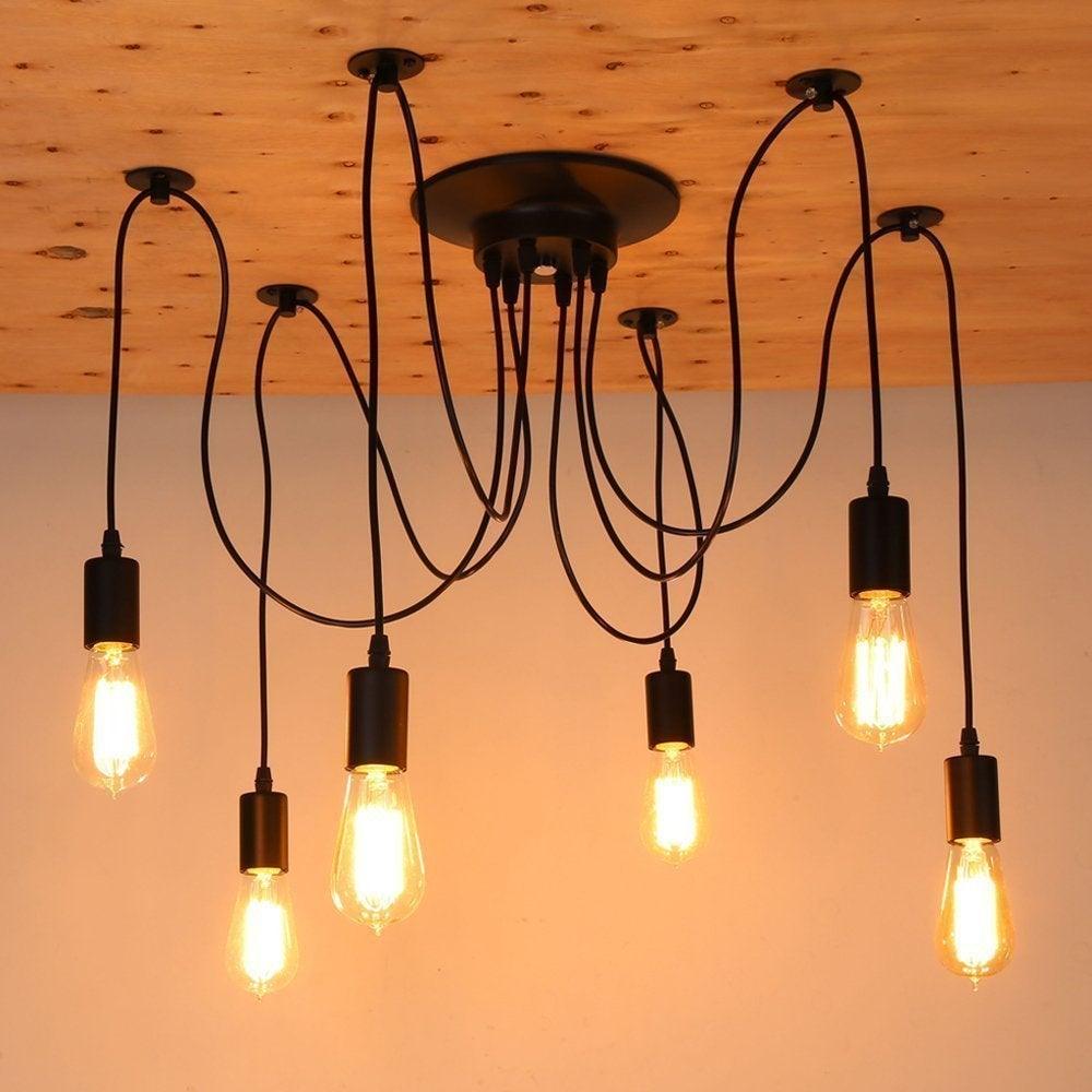 Vintage Edison bulb chandelier with eight warm amber filament bulbs and black cords on Tampa Home & Garden Store