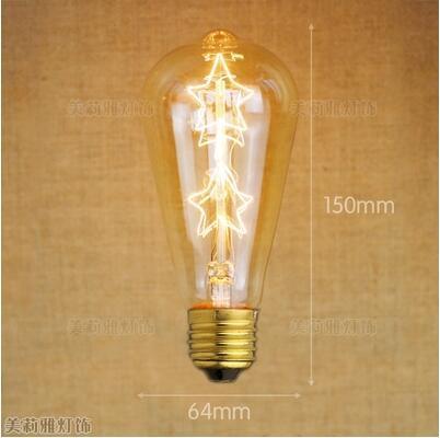 Retro Edison bulb with visible star filament, warm amber glow, vintage decorative incandescent on Tampa Home & Garden Store
