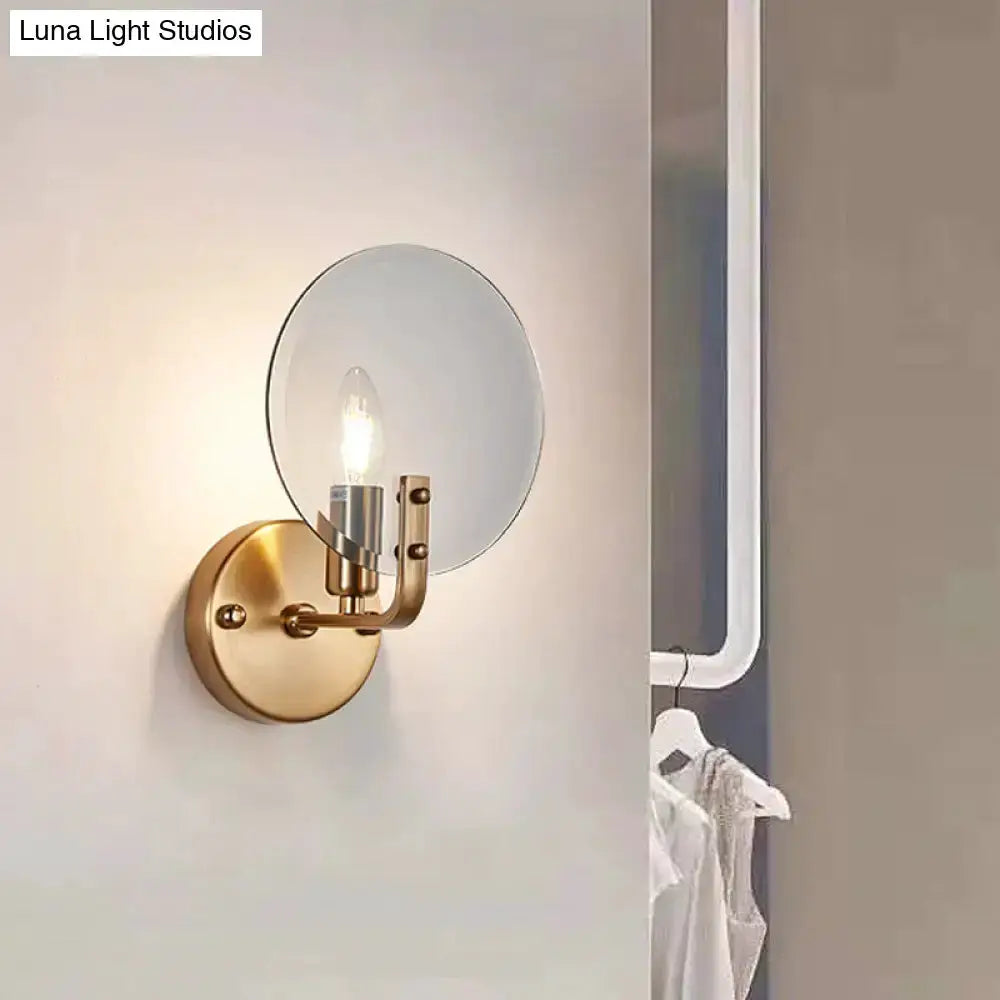 Retro gold wall sconce with round blue glass shade and exposed bulb by Decorbites on Tampa Home & Garden Store