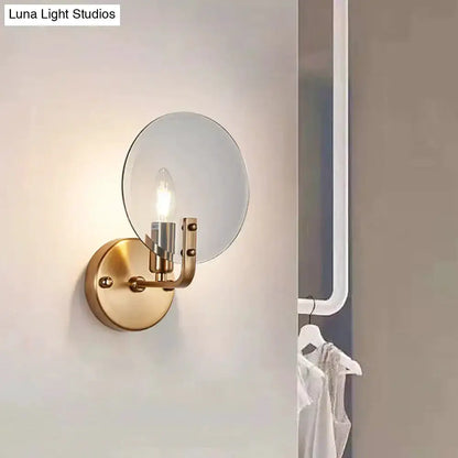 Retro gold wall sconce with round blue glass shade and exposed bulb by Decorbites on Tampa Home & Garden Store