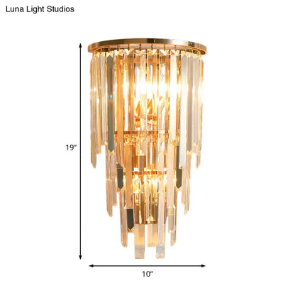 Gold crystal waterfall sconce by Decorbites with a gold frame and hanging prisms on Tampa Home & Garden Store