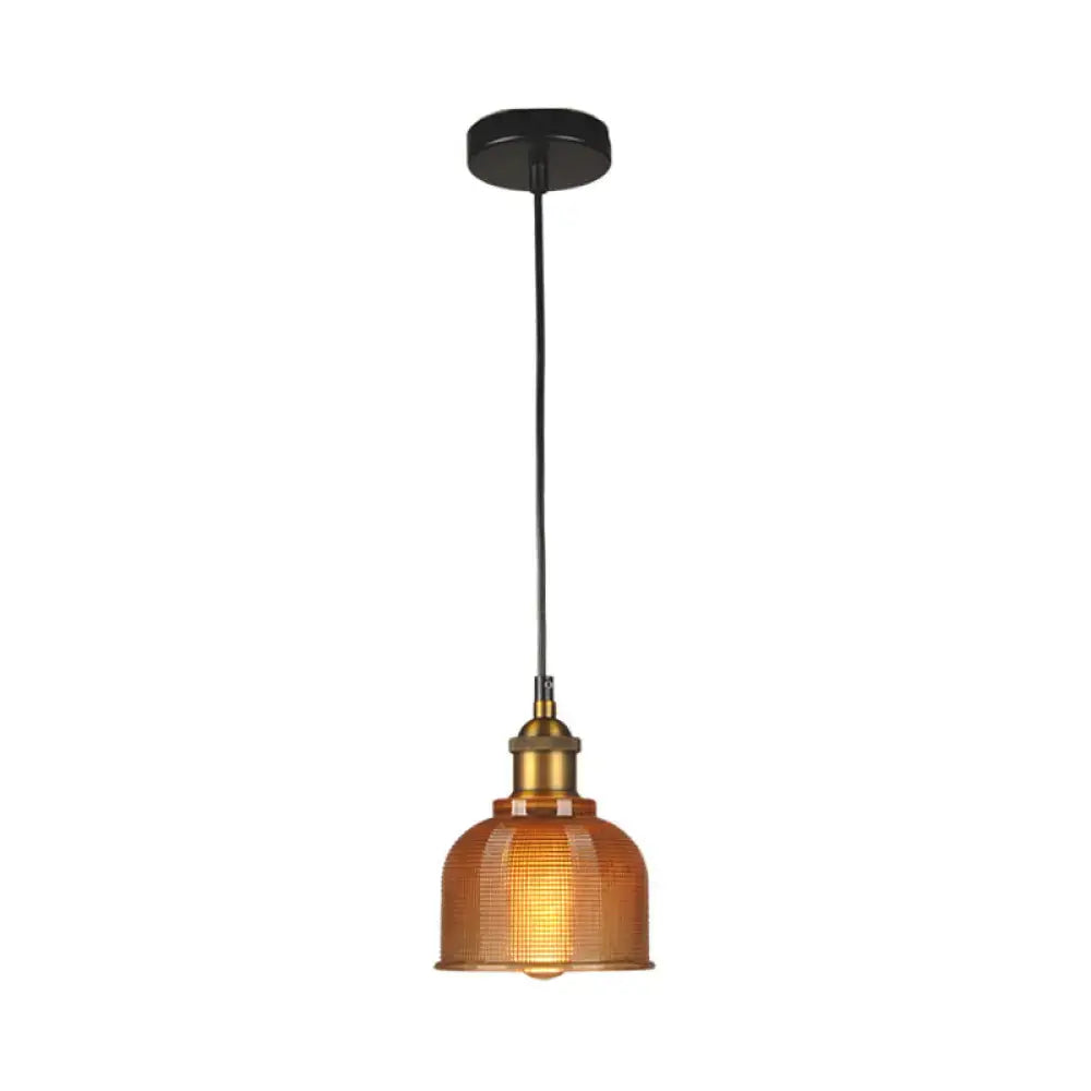 Red amber glass pendant light with brass cap and black cord on Tampa Home & Garden Store