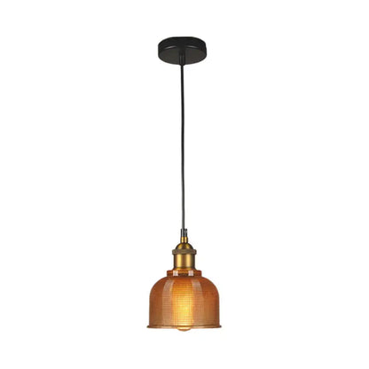 Red amber glass pendant light with brass cap and black cord on Tampa Home & Garden Store