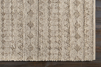 Argonne Area Rug natural beige jute with diamond motif and braided border on wood floor on Tampa Home & Garden Store