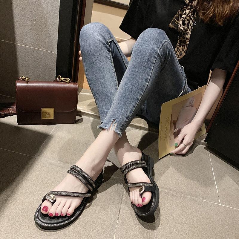Pair of rhinestone sandals by Stevvex, black leather straps, flat sole on Tampa Home & Garden Store