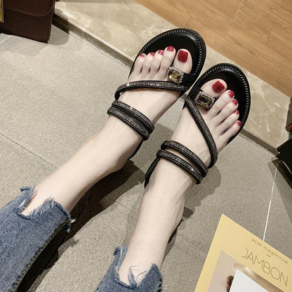 Stevvex rhinestone sandals pair with multiple black leather straps and square crystal buckle on Tampa Home & Garden Store