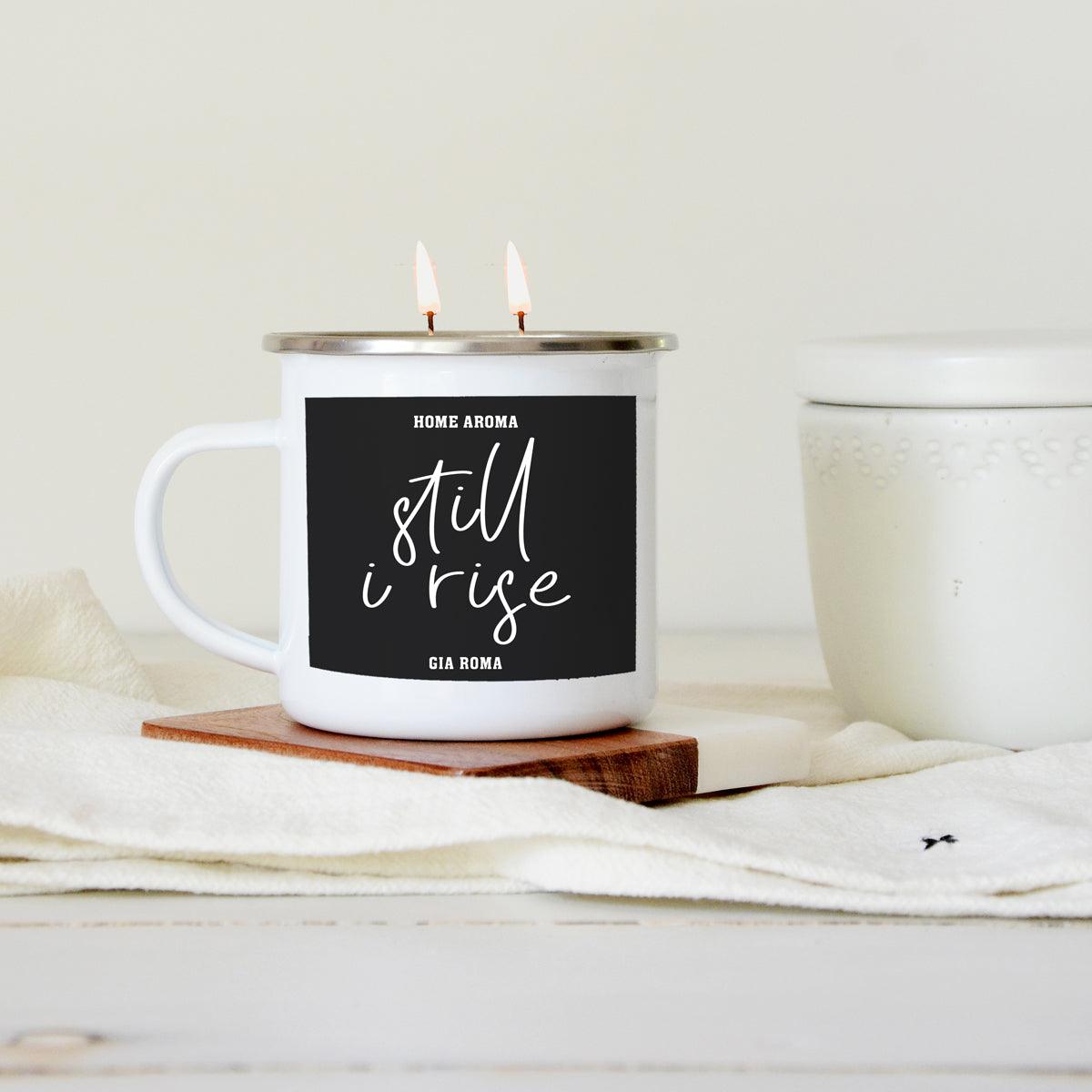 16oz candle mug by Gia Roma with black label still i rise and two lit wicks on a coaster on Tampa Home & Garden Store