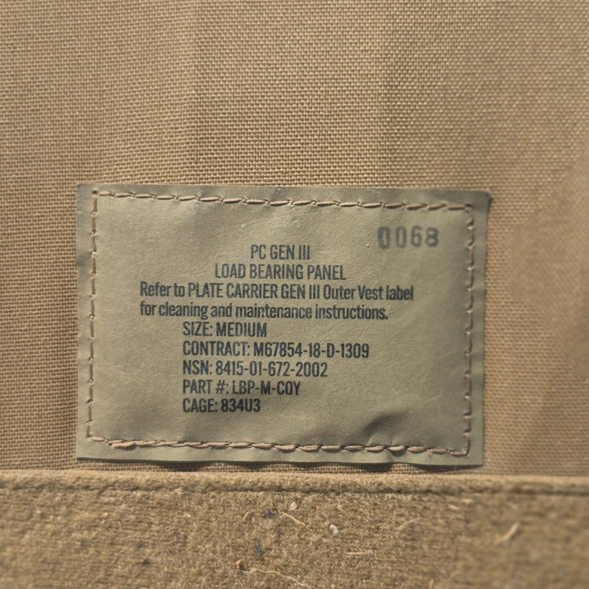 USMC plate carrier Gen III load bearing panel tag on tan fabric on Tampa Home & Garden Store