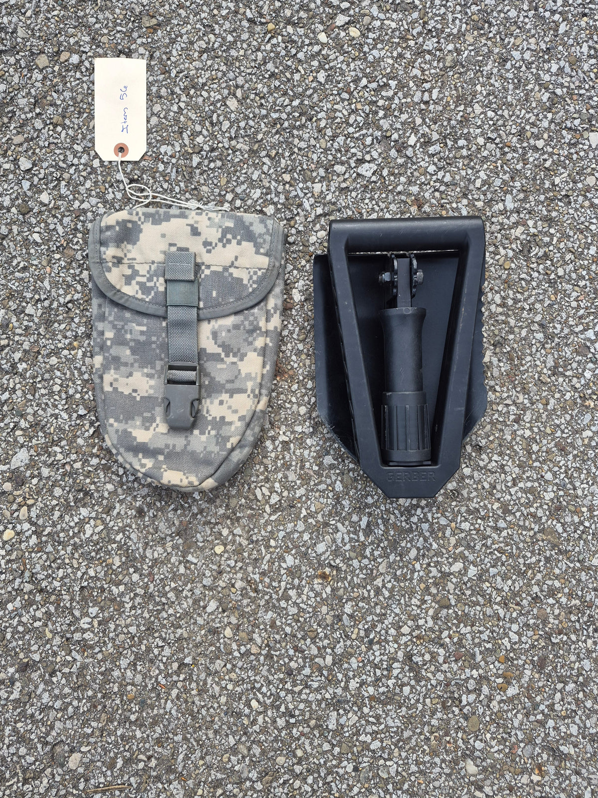 Gerber folding entrenching shovel with black steel head beside camo carry pouch on Tampa Home & Garden Store