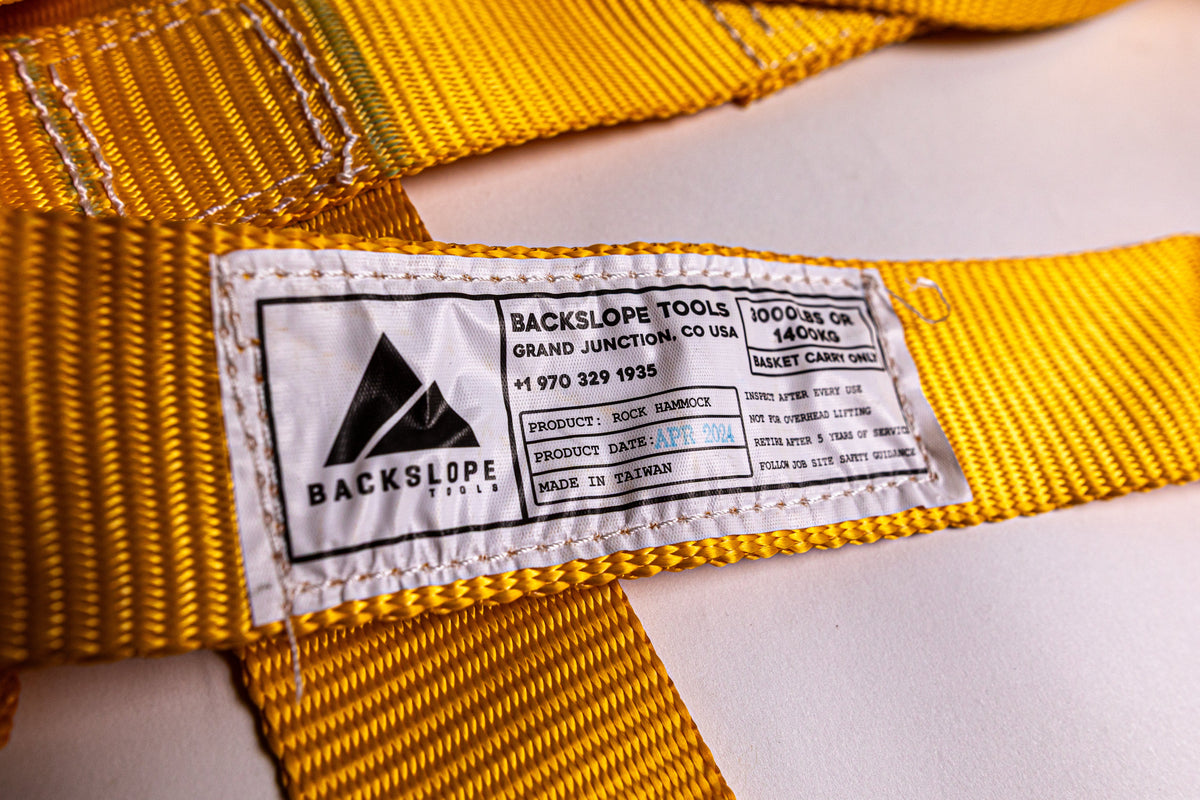 Rock Hammock nylon strap by Backslope Tools, yellow webbing with brand tag on Tampa Home & Garden Store