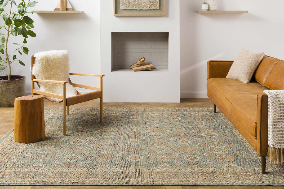 Rockton Area Rug in blue-gray with beige distressed pattern in a cozy living room on Tampa Home & Garden Store