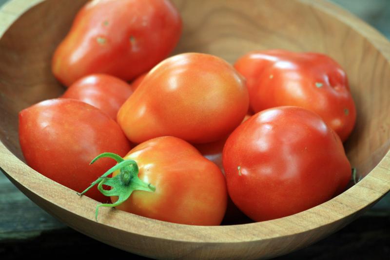 Roma VF paste tomato seeds ripe red in a wooden bowl Seedtime Store on Tampa Home & Garden Store