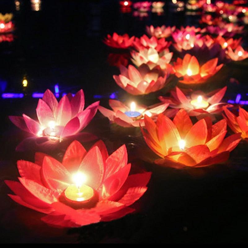 Floating lotus LED candles by Stevvex glow pink, red and orange on water on Tampa Home & Garden Store