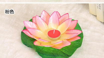 Romantic lotus LED candle on green lotus leaf base with pink-yellow petals and red center on Tampa Home & Garden Store