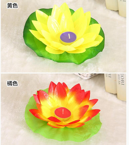 Floating lotus LED candles in yellow and orange with green leaf bases, flameless decor on Tampa Home & Garden Store
