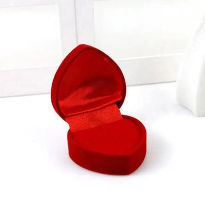 Red heart-shaped velvet jewelry box with satin lining open on Tampa Home & Garden Store