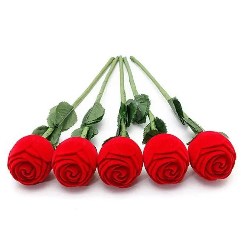 Five red artificial roses with green stems arranged in a row on white background on Tampa Home & Garden Store