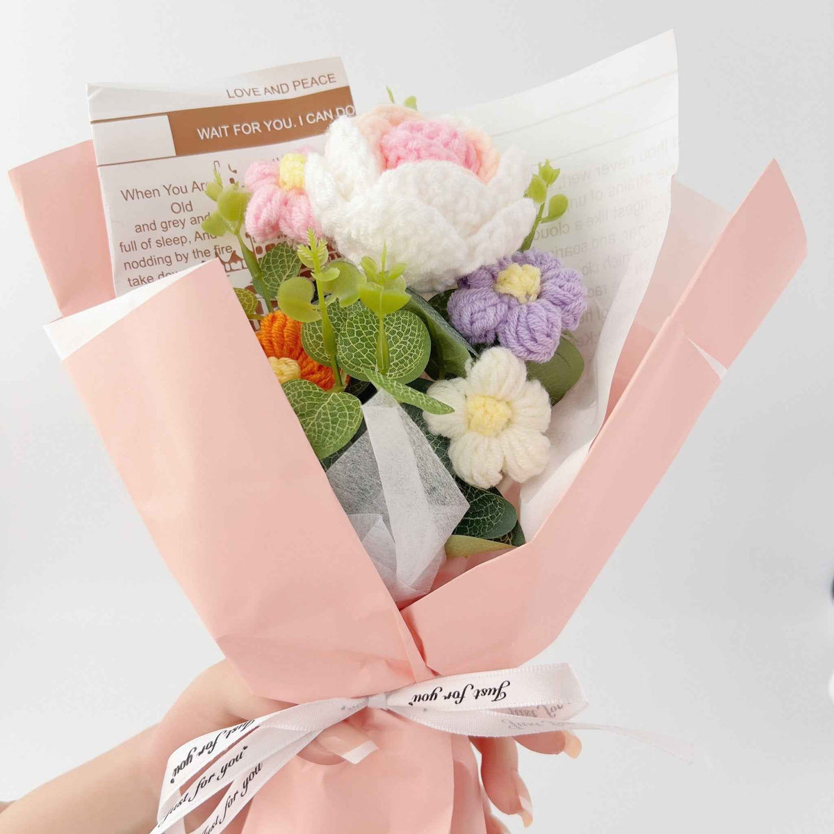 Rose crochet bouquet with pink white and purple blooms green leaves in pink wrap by Shaketea on Tampa Home & Garden Store