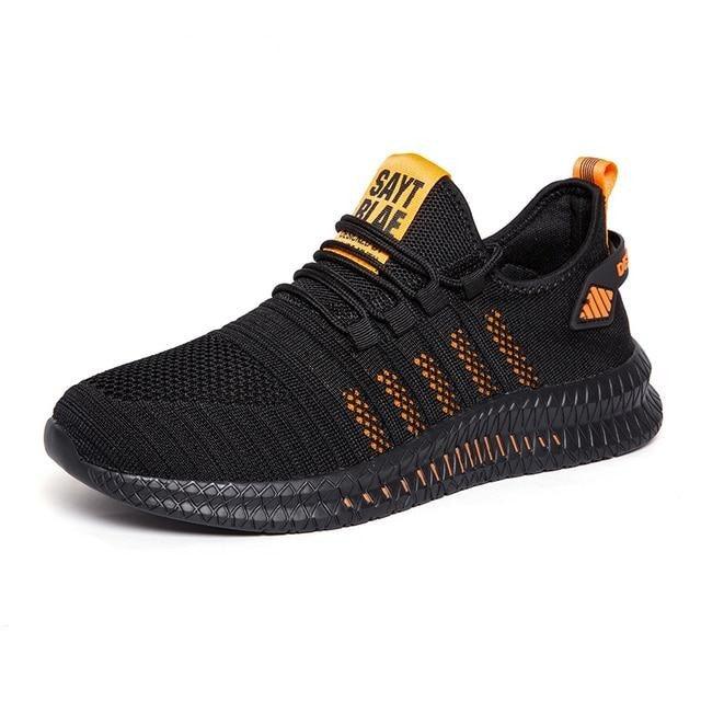 Stevvex men's running sneakers, black knit upper with orange accents and non-slip sole on Tampa Home & Garden Store