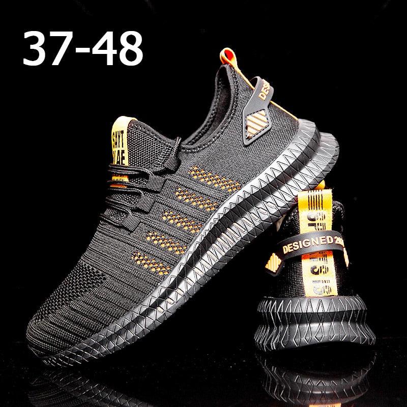 Running sneakers for men by Stevvex, breathable black knit upper with orange accents on Tampa Home & Garden Store