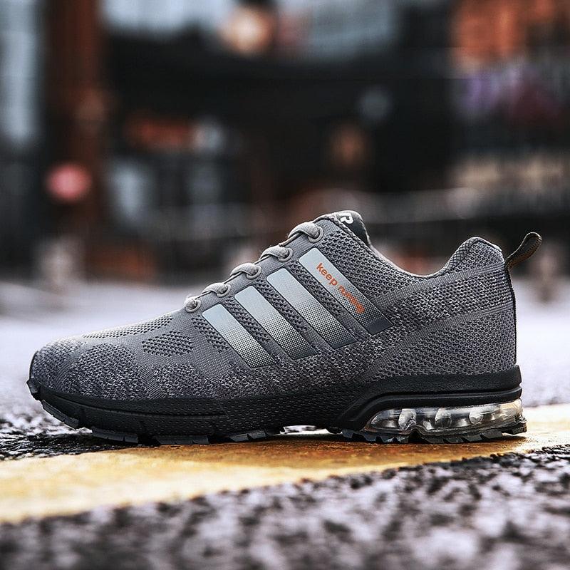 Running Stevvex gray mesh athletic sneakers with side stripes and air-cushion sole on Tampa Home & Garden Store
