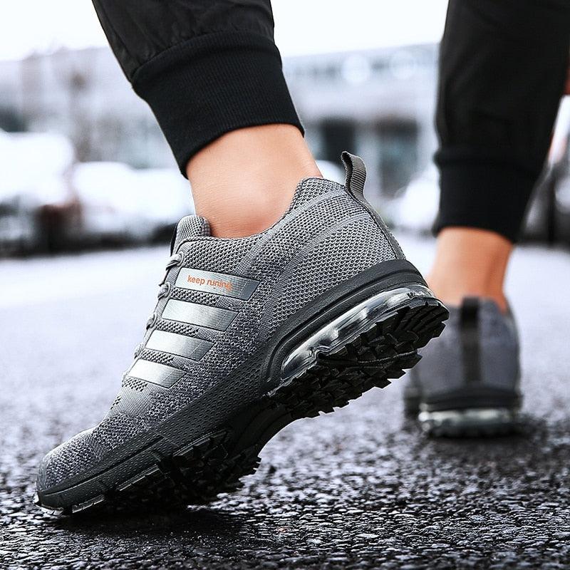 Grey running sneaker with lace-up low top, breathable mesh upper and air-cushion sole on Tampa Home & Garden Store