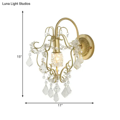 Gold Crystal Bent Arm Sconce by Decorbites, gold finish wall sconce with hanging crystal prisms on Tampa Home & Garden Store