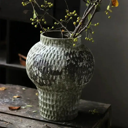 Rustic gray and white coarse pottery vase by Decorbites with textured finish and green berries on Tampa Home & Garden Store